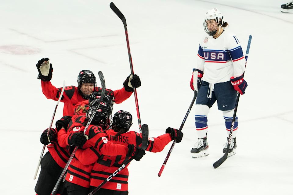 Team Canada forward Sarah Nurse (20) celebrates with teammates after scoring a goal as against the U.S. in the first period of the gold-medal game.