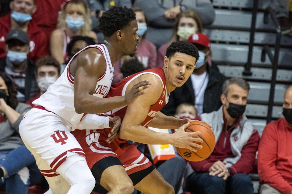 Wisconsin guard Johnny Davis looks to drive while Indiana guard Xavier Johnson defends Tuesday night in Bloomington, Indiana.