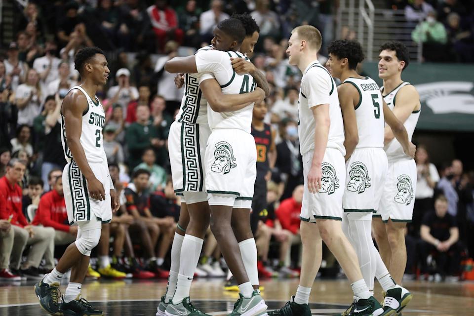 Michigan State Spartans forwards Marcus Bingham Jr. and Gabe Brown embrace at half-court before leaving the game against the Maryland Terrapins, Sunday, March 6, 2022 at the Breslin Center.