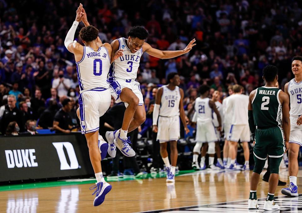 Duke's Wendell Moore Jr. (0) and Jeremy Roach celebrate after beating Michigan State.