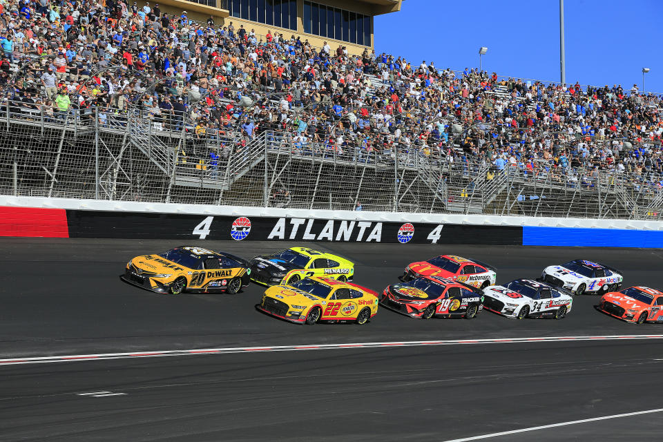 HAMPTON, GA - MARCH 20: Christopher Bell (#20 Joe Gibbs Racing DeWalt Toyota) leads the cars through Turn 4 during the running of the 64th Annual Folds of Honor QuikTrip 500 NASCAR Cup Series Series race on March 20, 2022 at the newly repaved and reconfigured Atlanta Motor Speedway in Hampton, Georgia. (Photo by David J. Griffin/Icon Sportswire via Getty Images)