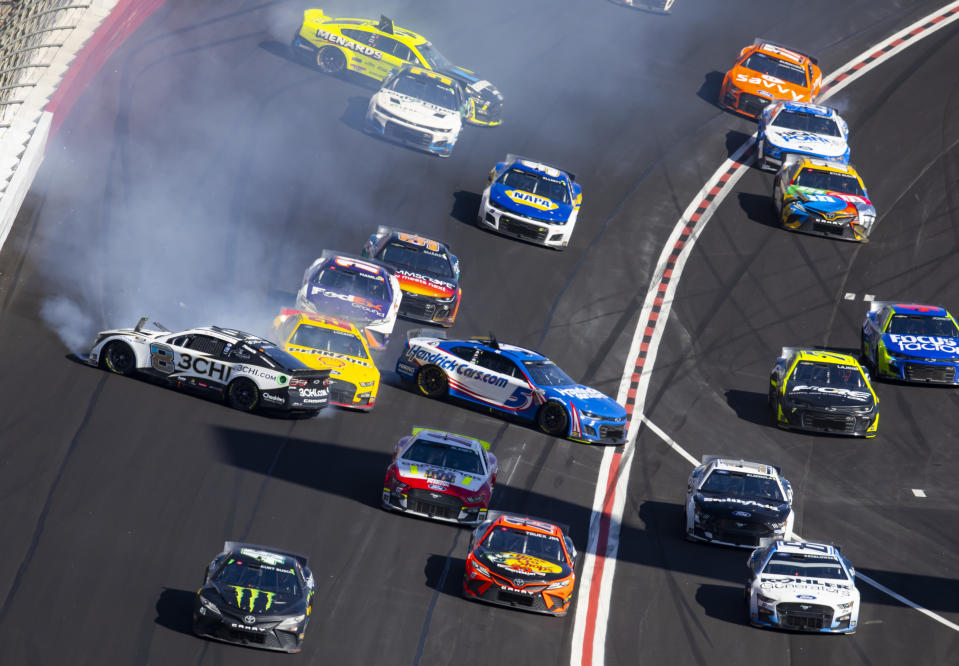 Mar 20, 2022; Hampton, Georgia, USA; NASCAR Cup Series driver Tyler Reddick (8) and Kyle Larson (5) crash during the Folds of Honor QuikTrip 500 at Atlanta Motor Speedway. Mandatory Credit: Mark J. Rebilas-USA TODAY Sports