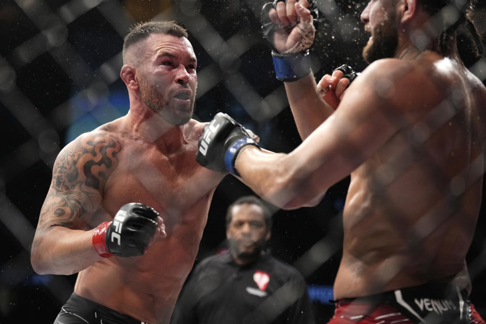 LAS VEGAS, NEVADA - MARCH 05: (L-R) Colby Covington punches Jorge Masvidal in their welterweight fight during the UFC 272 event on March 05, 2022 in Las Vegas, Nevada. (Photo by Chris Unger/Zuffa LLC)