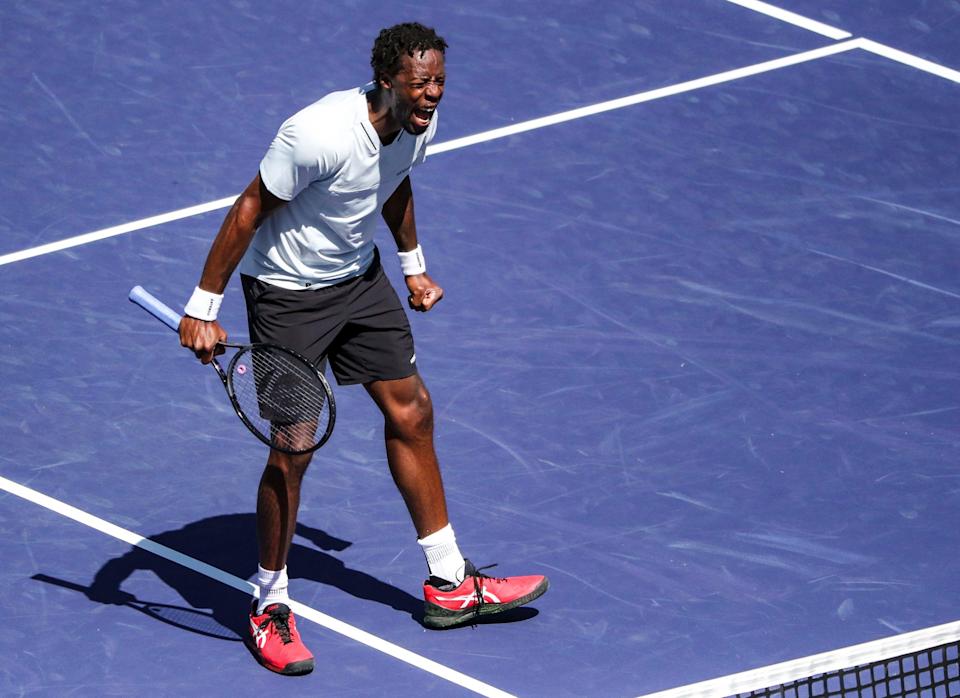 Gael Monfils of France screams in celebration after beating No. 1 Daniil Medvedev of Russia.