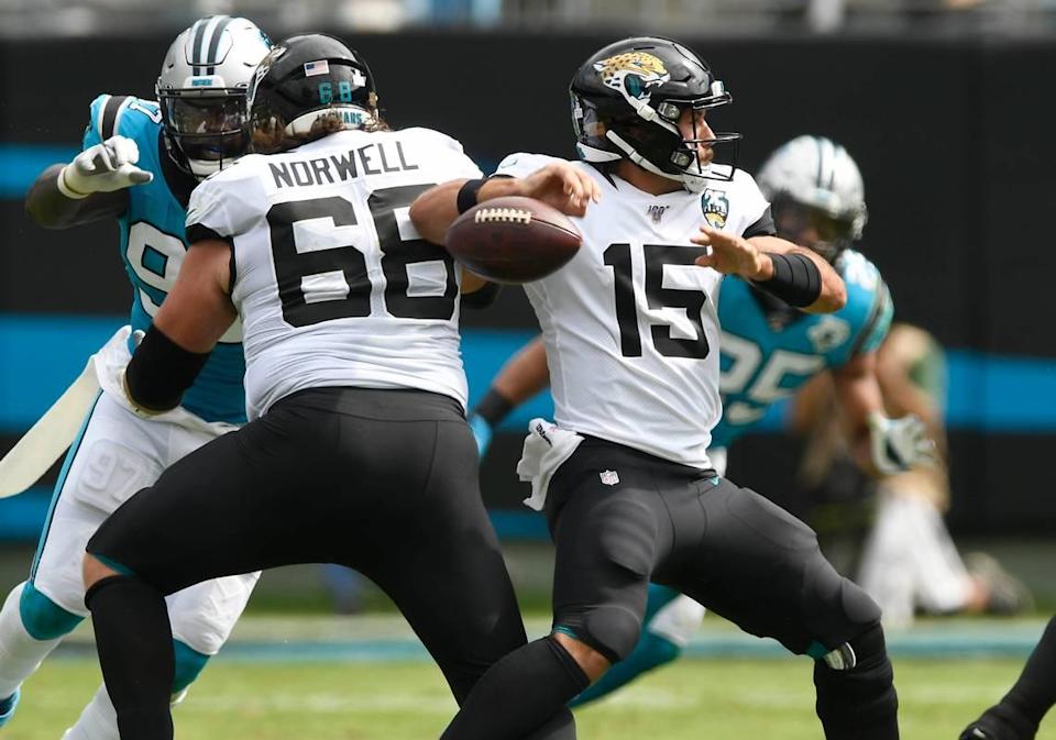 Jacksonville Jaguars quarterback Gardner Minshew (15) fumbles the ball as Carolina Panthers linebacker Mario Addison (97) pressures Jacksonville Jaguars offensive guard Andrew Norwell (68) in the first quarter at Bank of America Stadium in Charlotte, NC on Sunday, October 6, 2019.