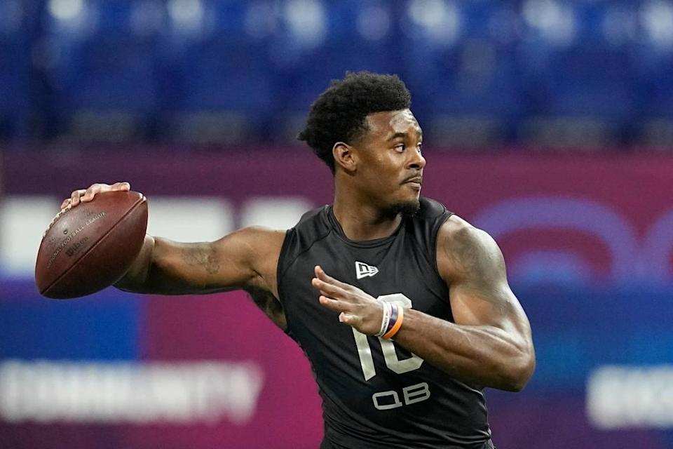 Liberty quarterback Malik Willis runs a drill during the NFL football scouting combine, Thursday, March 3, 2022, in Indianapolis. (AP Photo/Darron Cummings)