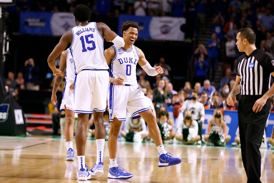 GREENVILLE, SC - MARCH 20: Mark Williams #15 celebrates with Wendell Moore Jr. #0 of the Duke Blue Devils near the end of their game against the Michigan State Spartans in the second round game of the 2022 NCAA Men's Basketball Tournament at Bon Secours Wellness Arena on March 20, 2022 in Greenville, South Carolina. (Photo by Lance King/Getty Images)