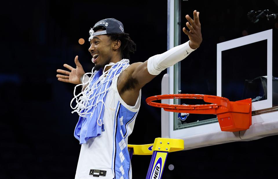 North Carolina Tar Heels guard Leaky Black (1) cuts down the net after the Tar Heels defeated the St. Peters Peacocks in the finals of the East regional of the men's college basketball NCAA Tournament at Wells Fargo Center.