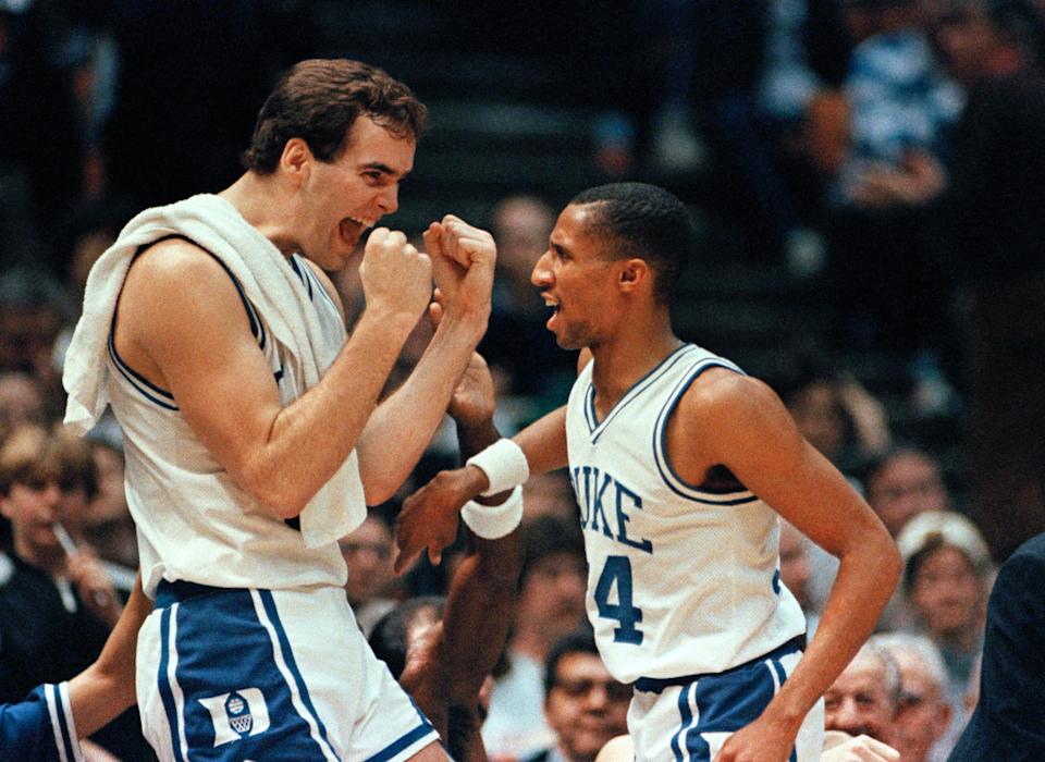 Duck's Danny Ferry (35) left, expresses his joy to teammate Johnny Dawkins (24) after winning the NCAA Eastern Regional Final against Navy on March 23, 1986 in East Rutherford. (AP Photo/Ray Stubblebine)