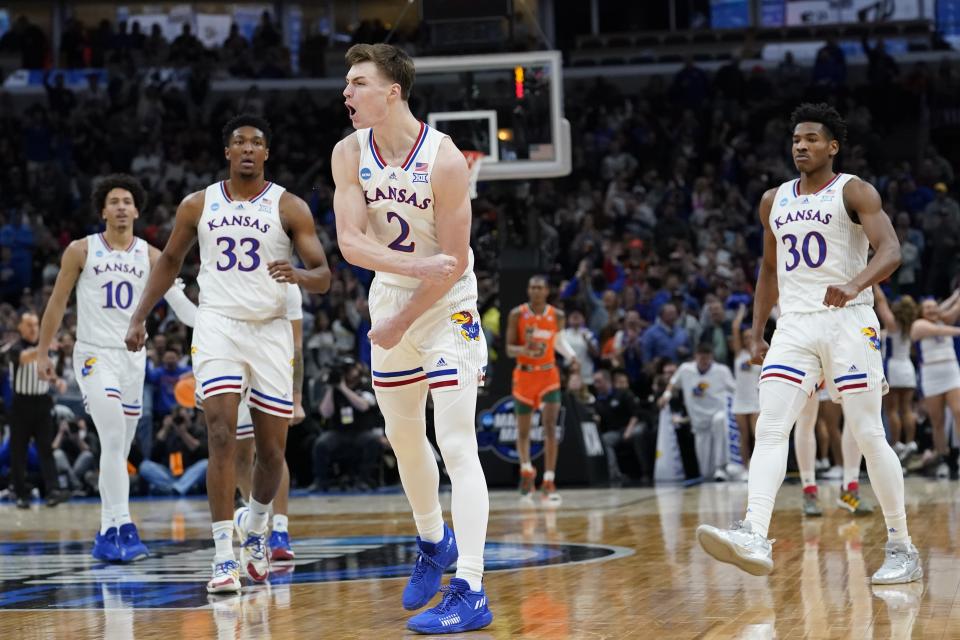 Kansas' Christian Braun reacts during the second half of a college basketball game in the Elite 8 round of the NCAA tournament Sunday, March 27, 2022, in Chicago. (AP Photo/Charles Rex Arbogast)