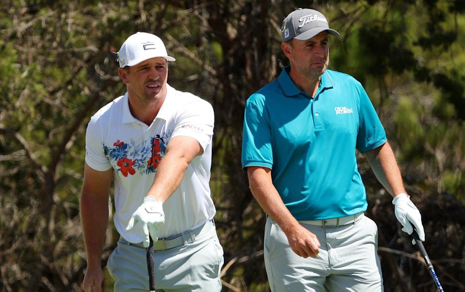 Bryson DeChambeau of the United States and Richard Bland of England look on from the second tee during the first day of the World Golf Championships-Dell Technologies Match Play at Austin Country Club on March 23, 2022 in Austin, Texas - Richard Bland keeps Masters dream alive at WGC World Match Play after halving with Bryson DeChambeau - GETTY IMAGES