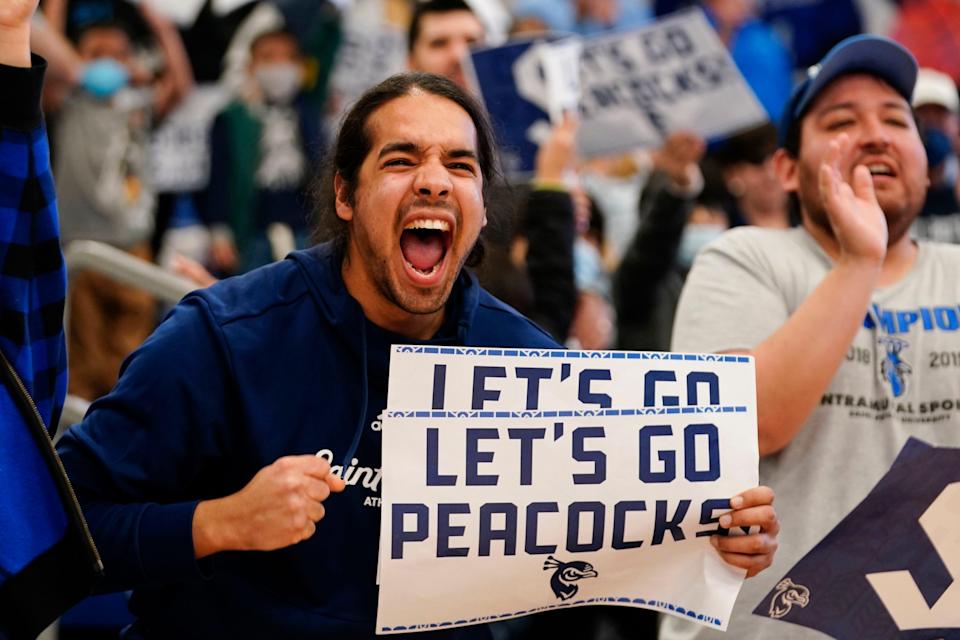 A couple hundred fans welcome home the players of the Saint Peter's University men's basketball team on Sunday, March 20, 2022, in Jersey City after their second-round win in the NCAA tournament.