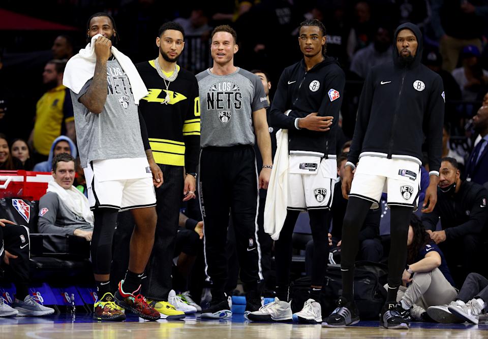 The Brooklyn Nets' Andre Drummond, Ben Simmons, Blake Griffin, Nic Claxton and Kevin Durant watch from the bench at the end of their blowout victory over the Philadelphia 76ers at Wells Fargo Center in Philadelphia on March 10, 2022. (Elsa/Getty Images)