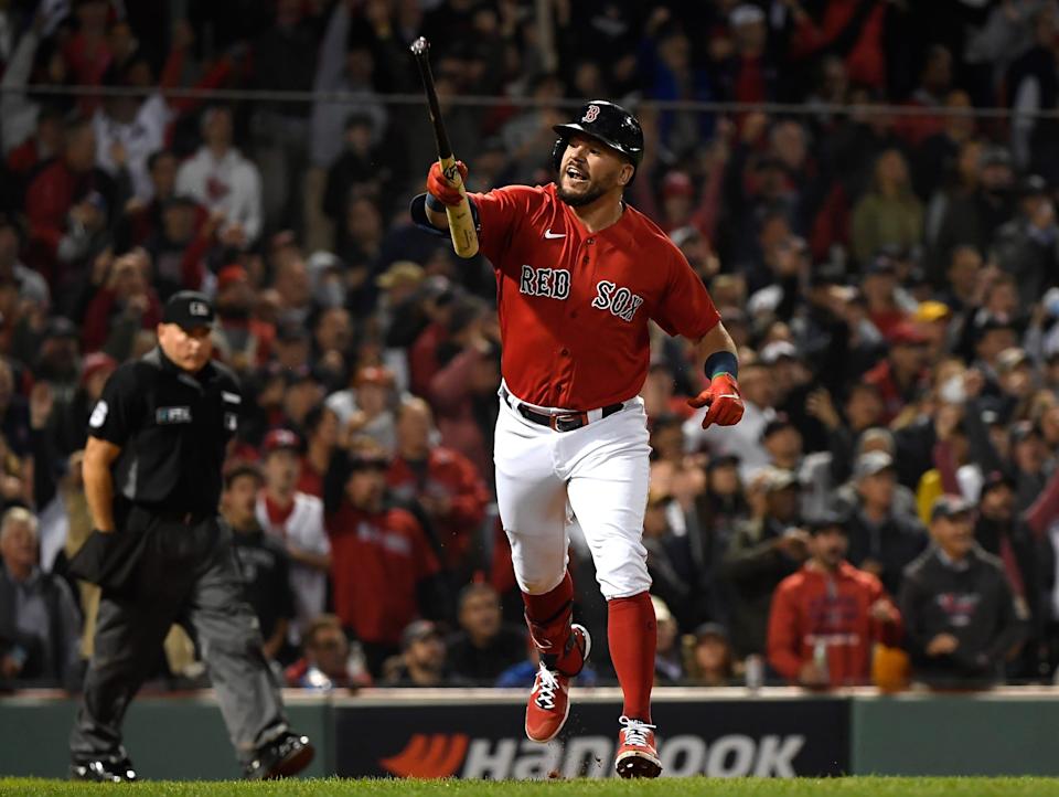 Kyle Schwarber reacts after hitting a home run in the 2021 AL wild-card game against the Yankees.