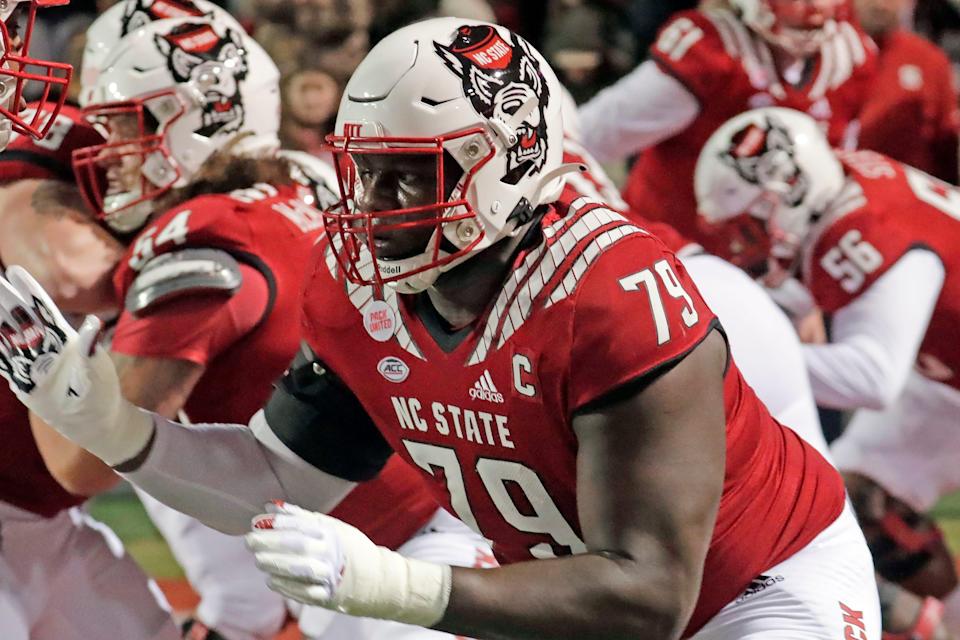 North Carolina State offensive tackle Ikem Ekwonu (79) warms up before an NCAA college football game against North Carolina Friday, Nov. 26, 2021, in Raleigh, N.C.