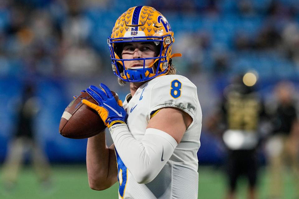 Pittsburgh Panthers quarterback Kenny Pickett (8) warms up before the ACC championship game against the Wake Forest Demon Deacons at Bank of America Stadium.