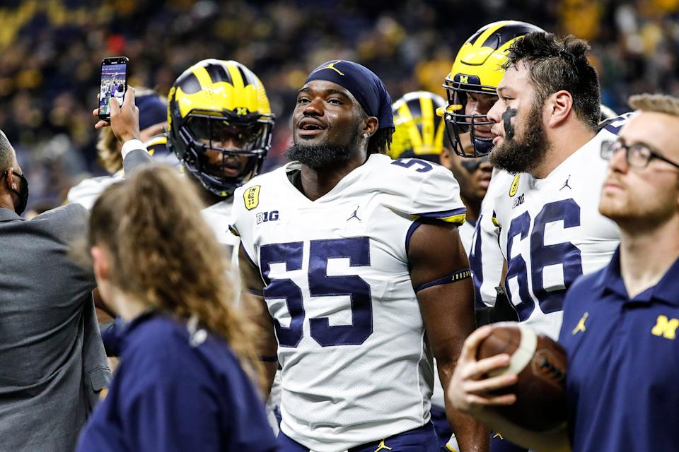 Michigan linebacker David Ojabo, center, during warmups before the Big Ten championship game against Iowa on Saturday, Dec. 4, 2021, at Lucas Oil Stadium in Indianapolis.