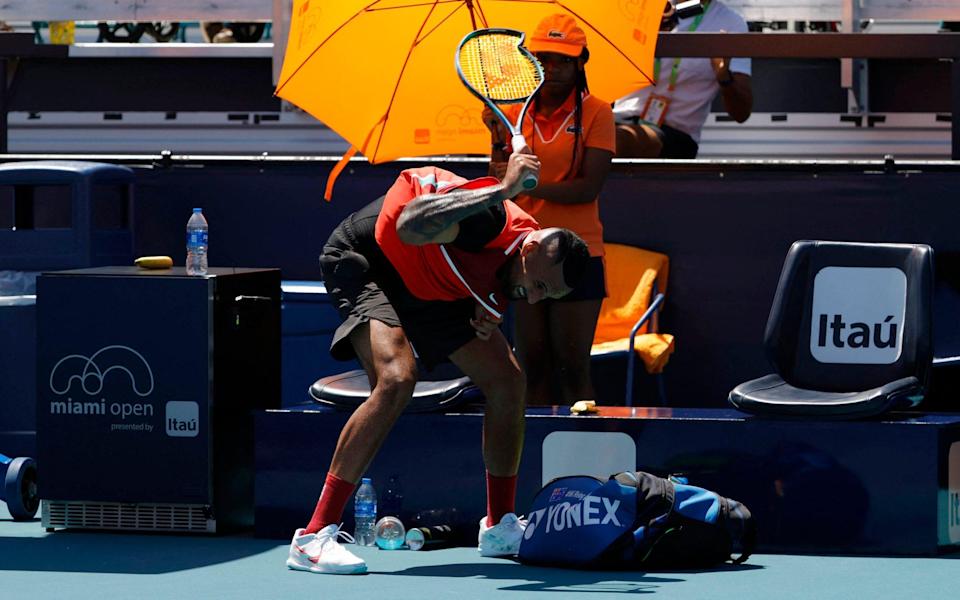 Nick Kyrgios (AUS) smashes his racquet at the end of the first set after being assessed a point penalty against Jannik Sinner (ITA)(not pictured) in a fourth round men's singles match in the Miami Open at Hard Rock Stadium. - Geoff Burke-USA TODAY Sports 