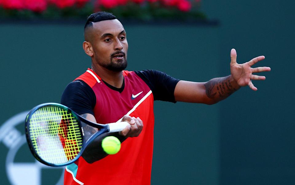 INDIAN WELLS, CALIFORNIA - MARCH 17 Nick Kyrgios of Australia plays a forehand against Rafael Nadal of Spain in their quarterfinal match on Day 11 of the BNP Paribas Open at the Indian Wells Tennis Garden on March 17, 2022 in Indian Wells, California. (Photo by ) - Clive Brunskill/Getty Images