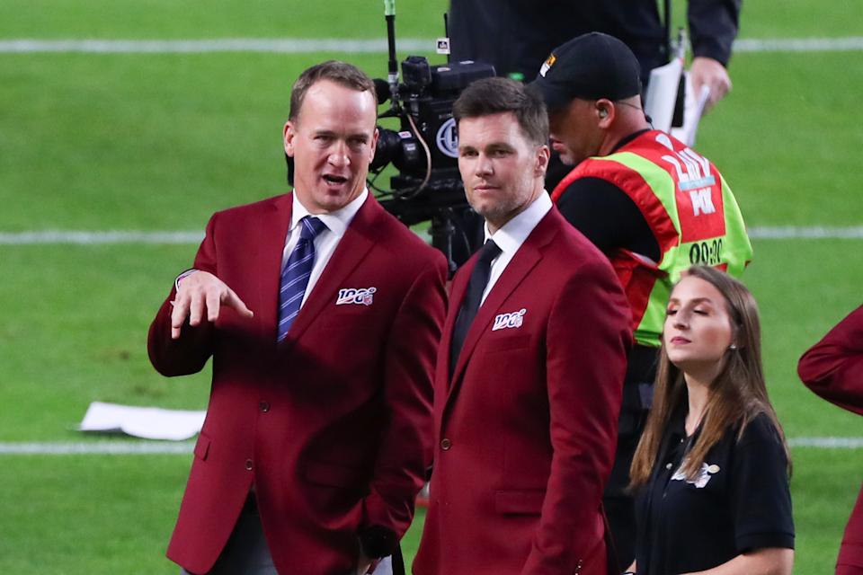 MIAMI GARDENS, FL - FEBRUARY 02: Tom Brady and Peyton Manning talk on the field during the 100 year team celebration prior to Super Bowl LIV on February 2, 2020 at Hard Rock Stadium in Miami Gardens, FL. (Photo by Rich Graessle/PPI/Icon Sportswire via Getty Images)