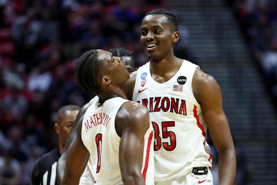 SAN DIEGO, CALIFORNIA - MARCH 20: Christian Koloko #35 and Bennedict Mathurin #0 of the Arizona Wildcats celebrate during the second half against the TCU Horned Frogs in the second round game of the 2022 NCAA Men's Basketball Tournament at Viejas Arena at San Diego State University on March 20, 2022 in San Diego, California. (Photo by Sean M. Haffey/Getty Images)