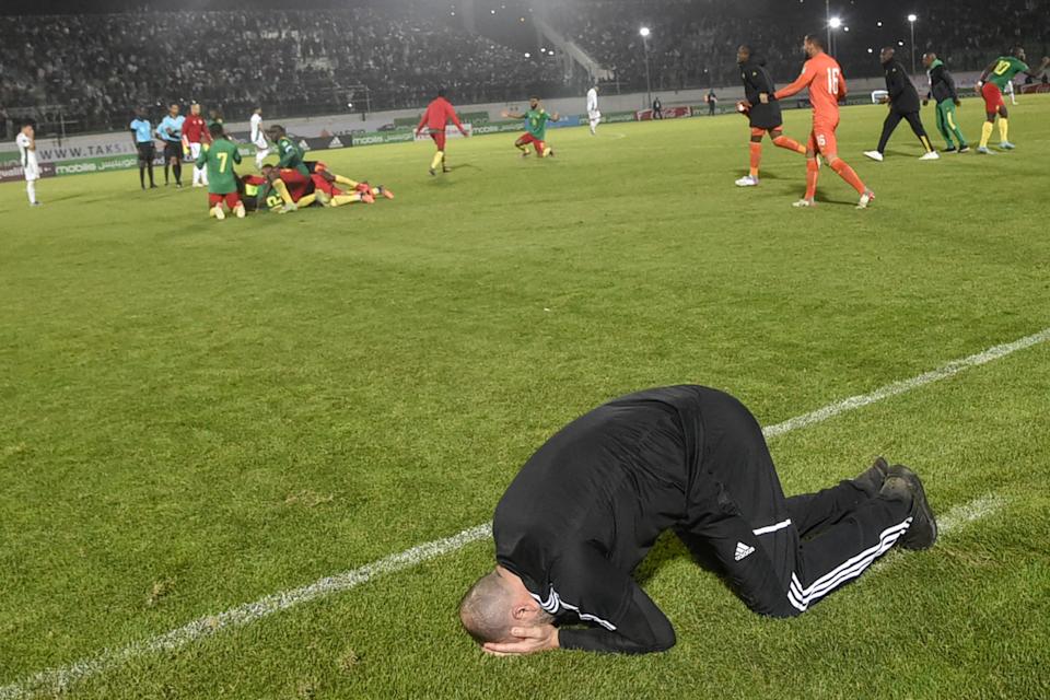 Algerian coach Djamel Belmadi and his team were denied a World Cup berth on one of the very last kicks of qualifying. (Photo by RYAD KRAMDI/AFP via Getty Images)