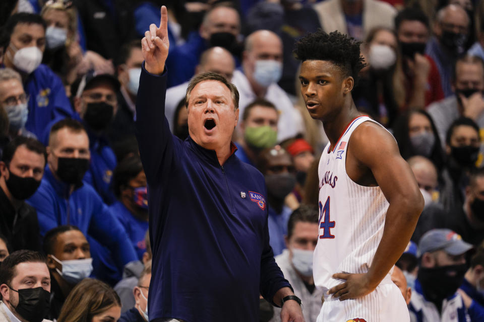 Kansas coach Bill Self calls a play while conversing with K.J. Adams during a game on Feb. 12. (Kyle Rivas/Getty Images)