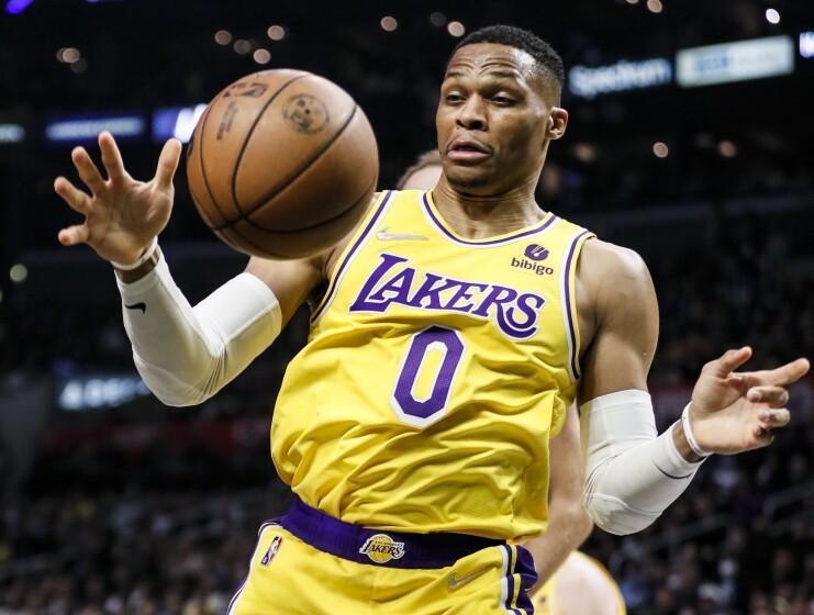 Los Angeles, CA - March 03: Los Angeles Lakers guard Russell Westbrook (0) reaches for the loose ball during the second half against the LA Clippers at Crypto.com on Thursday, March 3, 2022 in Los Angeles, CA.(Robert Gauthier / Los Angeles Times)