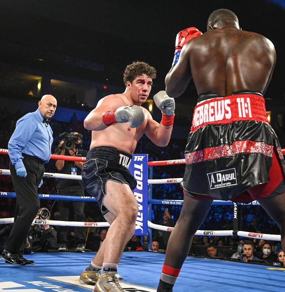 Richard Torrez Jr, right, boxes opponent Allen Melson during their fight at the Save Mart Center on Friday, March 4, 2022.