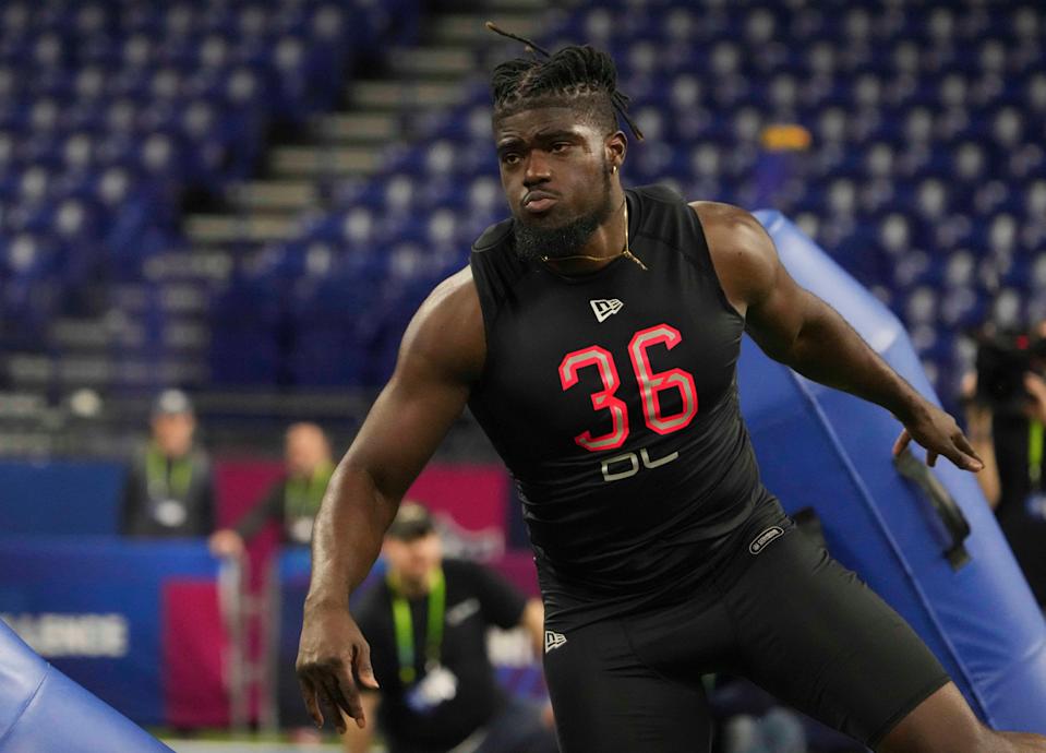 Michigan defensive lineman David Ojabo goes through drills during the NFL scouting combine at Lucas Oil Stadium.