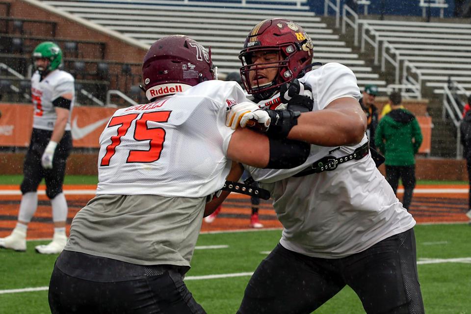 National Team offensive lineman Nick Zakelj of Fordham and offensive lineman Daniel Faalele of Minnesota run through drills during practice for the Reese's Senior Bowl Tuesday, Feb. 2, 2022, in Mobile, Ala.