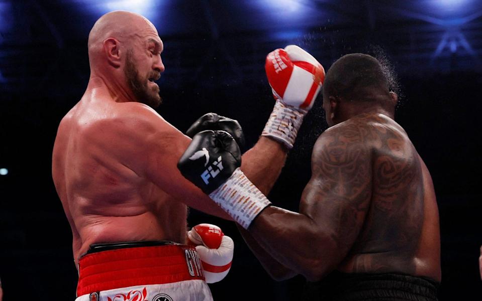 Tyson Fury knocks down Dillian Whyte to win the fight - ACTION IMAGES