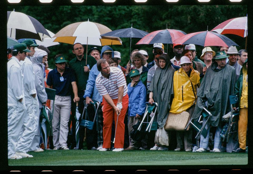 Craig Stadler putts in front of patrons at Augusta National during the 1982 Masters. Play was suspended late Thursday afternoon due to a rainstorm, which led to several logistical nightmares the next morning.