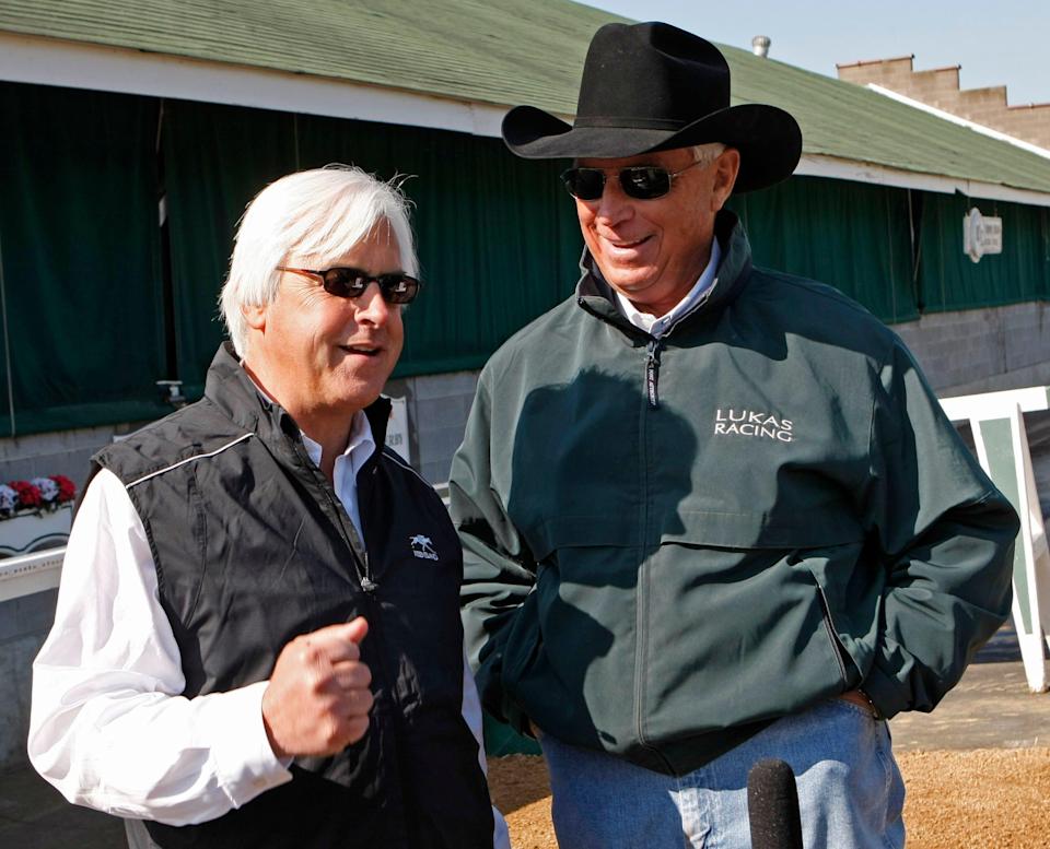 Kentucky Derby hopeful Conveyance trainer Bob Baffert, left, talks to Dublin trainer D. Wayne Lukas at Churchill Downs in Louisville, Ky.