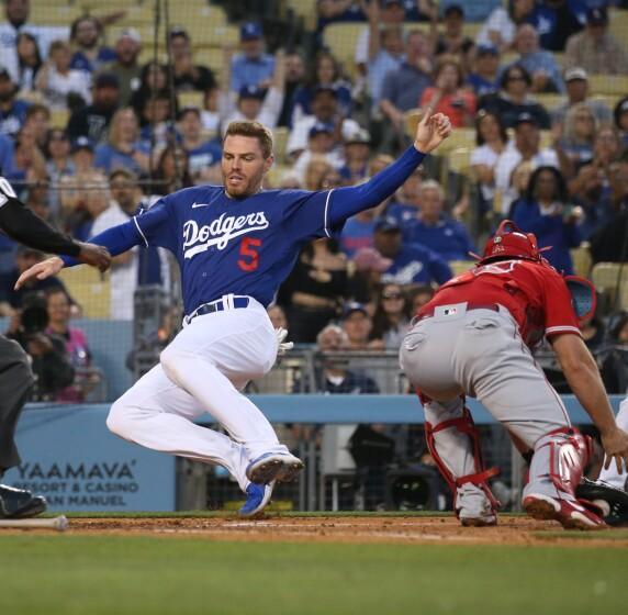 LOS ANGELES, CA - APRIL 05: Los Angeles Dodgers Freddie Freeman scores on a Max Muncy double in the third inning against the Los Angeles Angels during a preseason game at Dodger Stadium on Tuesday, April 5, 2022. (Myung J. Chun / Los Angeles Times)