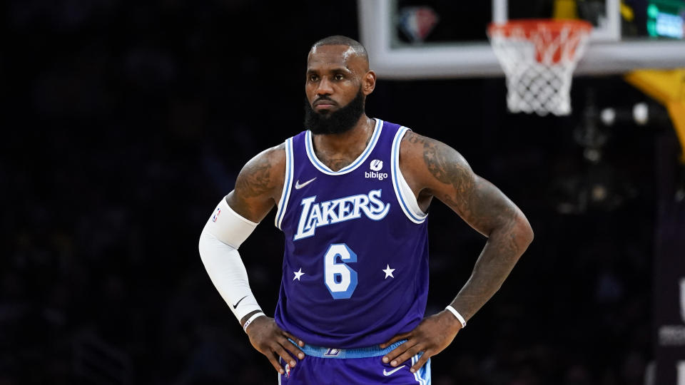 Los Angeles Lakers forward LeBron James (6) stands on the court during an NBA basketball game against the New Orleans Pelicans in Los Angeles, Friday, April 1, 2022. (AP Photo/Ashley Landis)