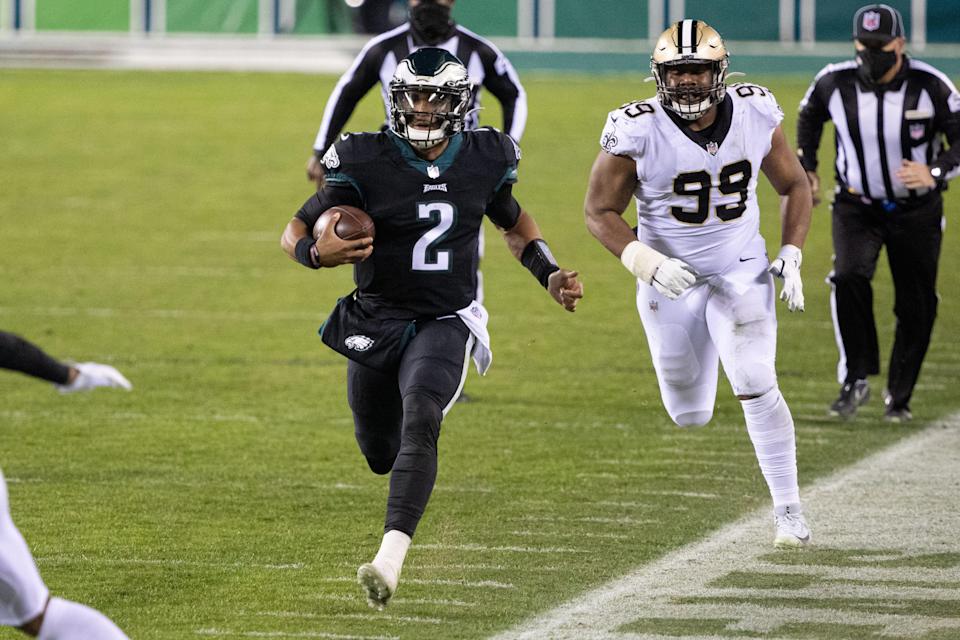 Philadelphia Eagles quarterback Jalen Hurts (2) runs with the ball past New Orleans Saints defensive tackle Shy Tuttle (99) during the second quarter at Lincoln Financial Field.