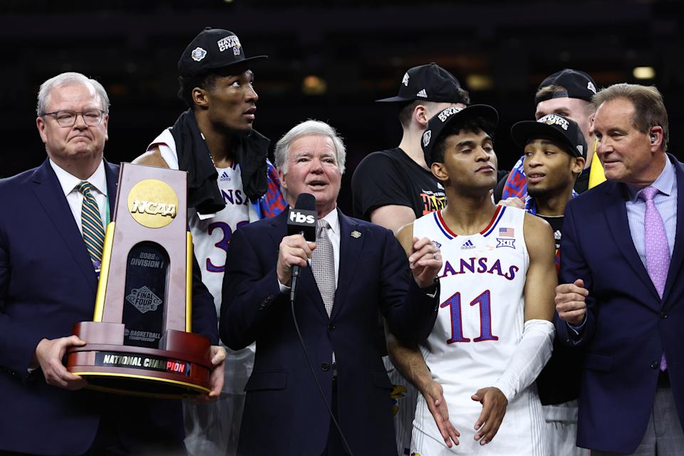 NEW ORLEANS, LOUISIANA - APRIL 04: NCAA president Dr. Mark Emmert presents the championship trophy to the Kansas Jayhawks after defeating the North Carolina Tar Heels 72-69 during the 2022 NCAA Men's Basketball Tournament National Championship at Caesars Superdome on April 04, 2022 in New Orleans, Louisiana. (Photo by Tom Pennington/Getty Images)