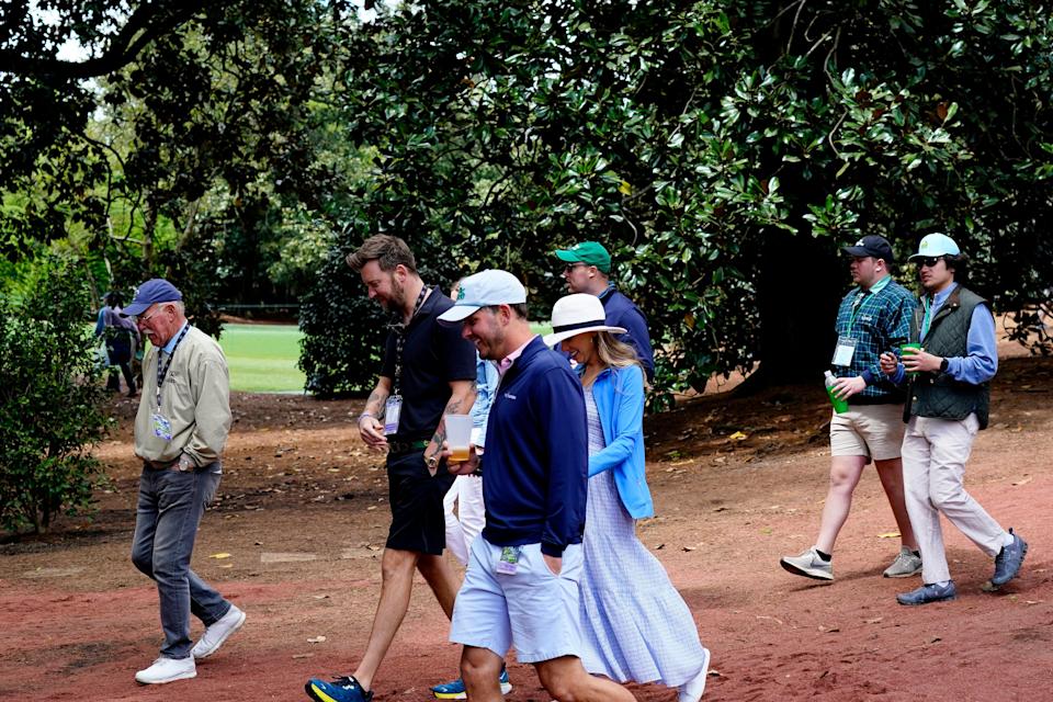 Patrons, including Charles Kelly of the country music group Lady A, walk in the woods on No. 10 where Bubba Watson hit a shot to the green at the 2012 Masters. Andrew Davis Tucker-Augusta Chronicle/USA TODAY Sports