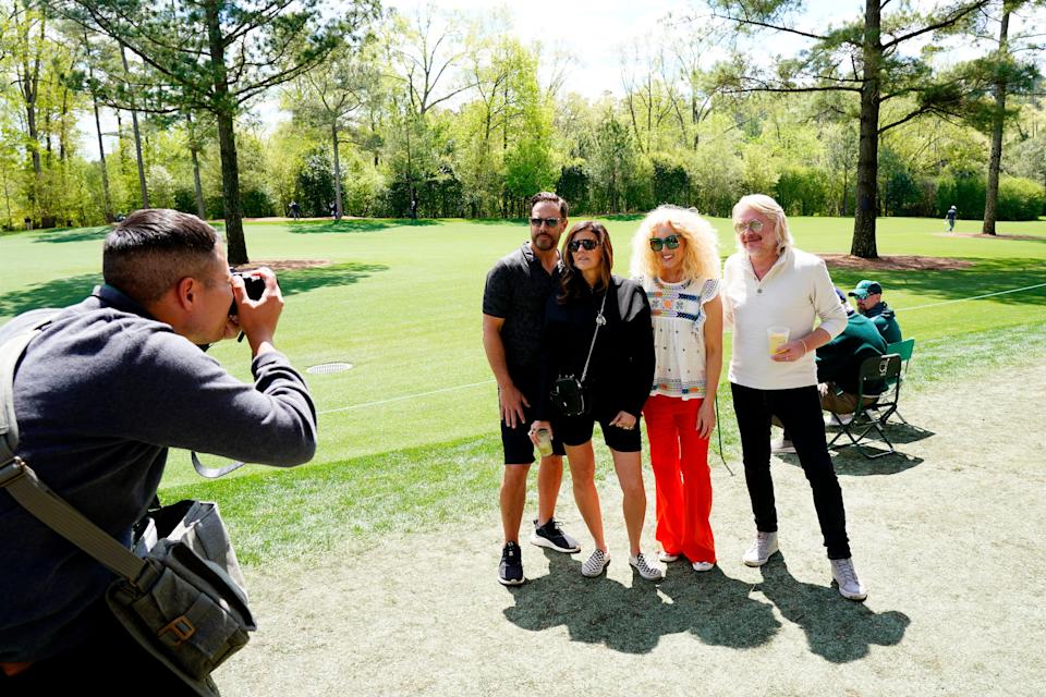 A photographer takes a picture of the musical group Little Big Town along the No. 11 fairway during the second round Friday. Andrew Davis Tucker-Augusta Chronicle/USA TODAY Sports