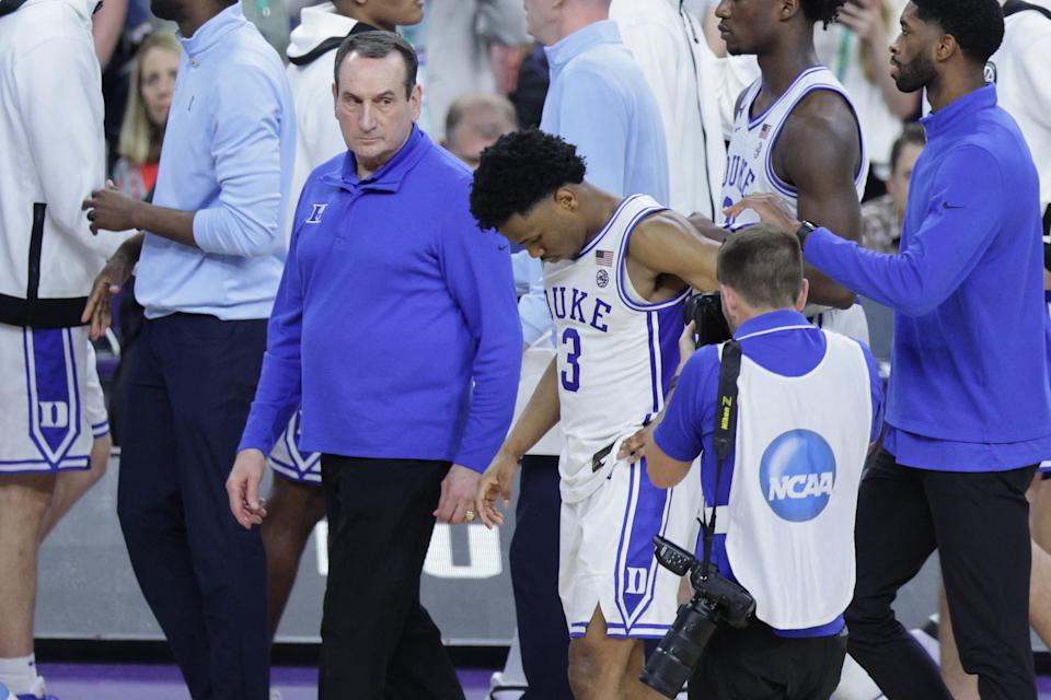 Apr 2, 2022; New Orleans, LA, USA; Duke Blue Devils head coach Mike Krzyzewski and guard Jeremy Roach (3) leave the court after a loss to the North Carolina Tar Heels during the 2022 NCAA men's basketball tournament Final Four semifinals at Caesars Superdome. Mandatory Credit: Stephen Lew-USA TODAY Sports