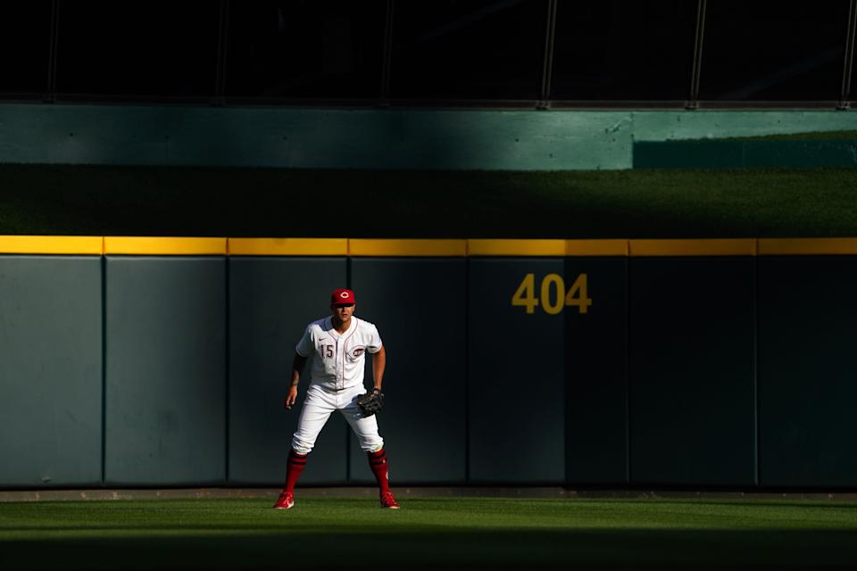 Cincinnati Reds center fielder Nick Senzel (15) gets set defensively in the seventh inning during a baseball game against the Cleveland Guardians, Tuesday, April 12, 2022, at Great American Ball Park in Cincinnati, Ohio. 