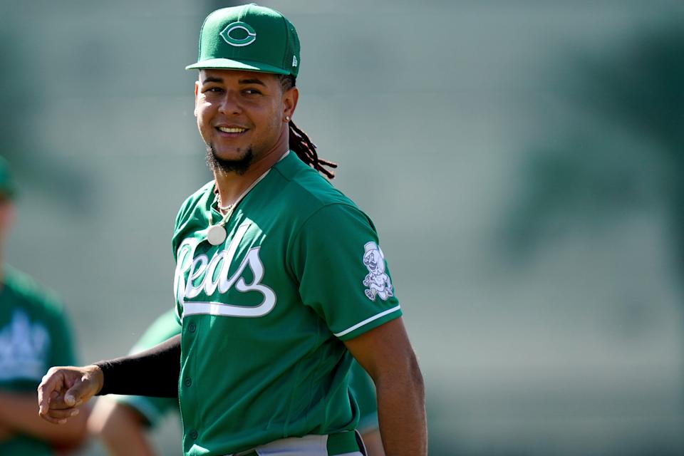 Cincinnati Reds Luis Castillo (58) smiles during defensive drills, Thursday, March 17, 2022, at the baseball team's spring training facility in Goodyear, Ariz.