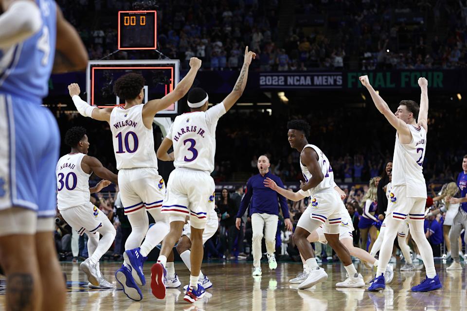 NEW ORLEANS, LOUISIANA - APRIL 04: Kansas Jayhawks players react after defeating the North Carolina Tar Heels 72-69 during the 2022 NCAA Men's Basketball Tournament National Championship at Caesars Superdome on April 04, 2022 in New Orleans, Louisiana. (Photo by Tom Pennington/Getty Images)