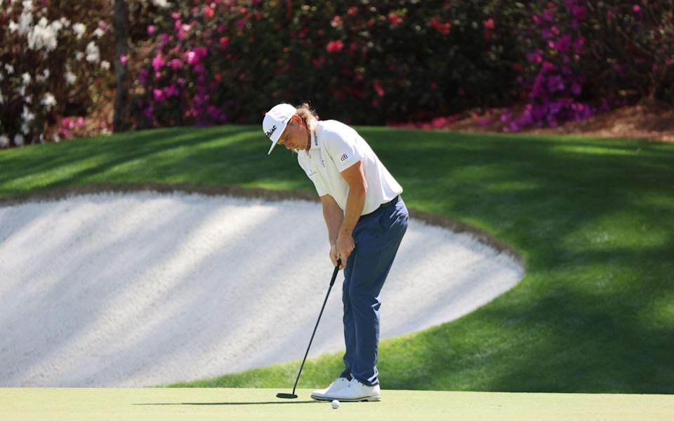 Cameron Smith of Australia putts on the thirteenth hole towards the tee on the fourteenth hole - Shutterstock