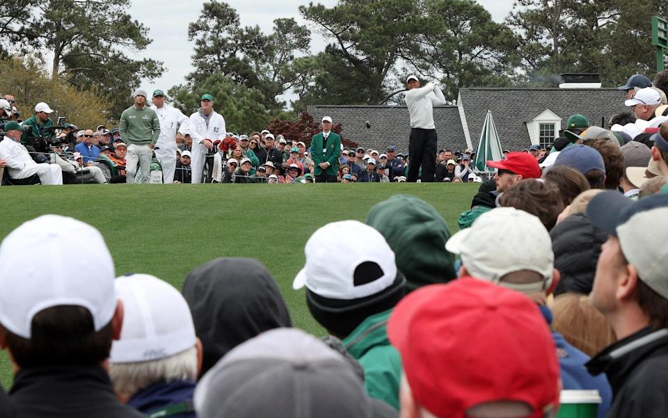 Tiger Woods plays his tee shot from the first - Jamie Squire/Getty Images