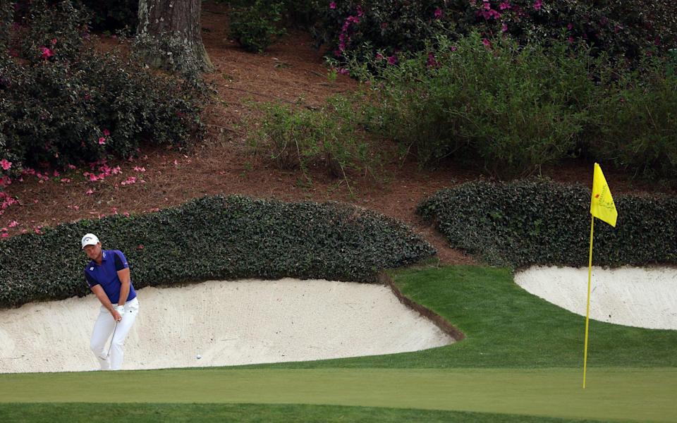 Danny Willett plays his second shot from the bunker on the 12th hole yesterday - Jamie Squire/Getty Images