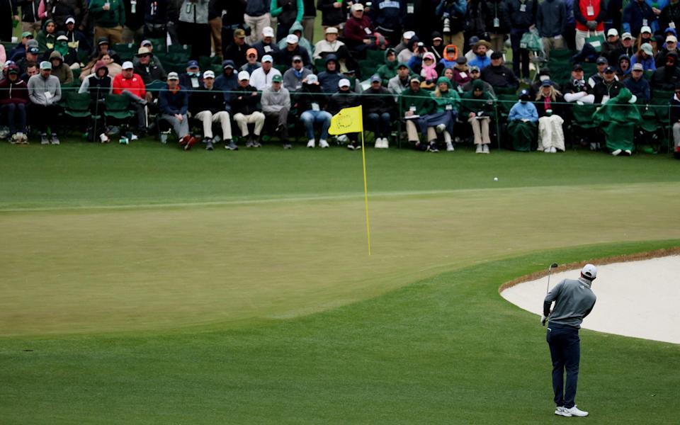 Dustin Johnson chips onto the 2nd green - REUTERS/Mike Segar