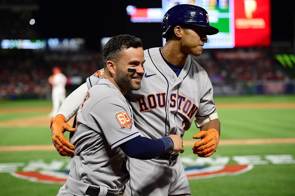 Astros shortstop Jeremy Pena is greeted by second baseman Jose Altuve after hitting a solo home run.
