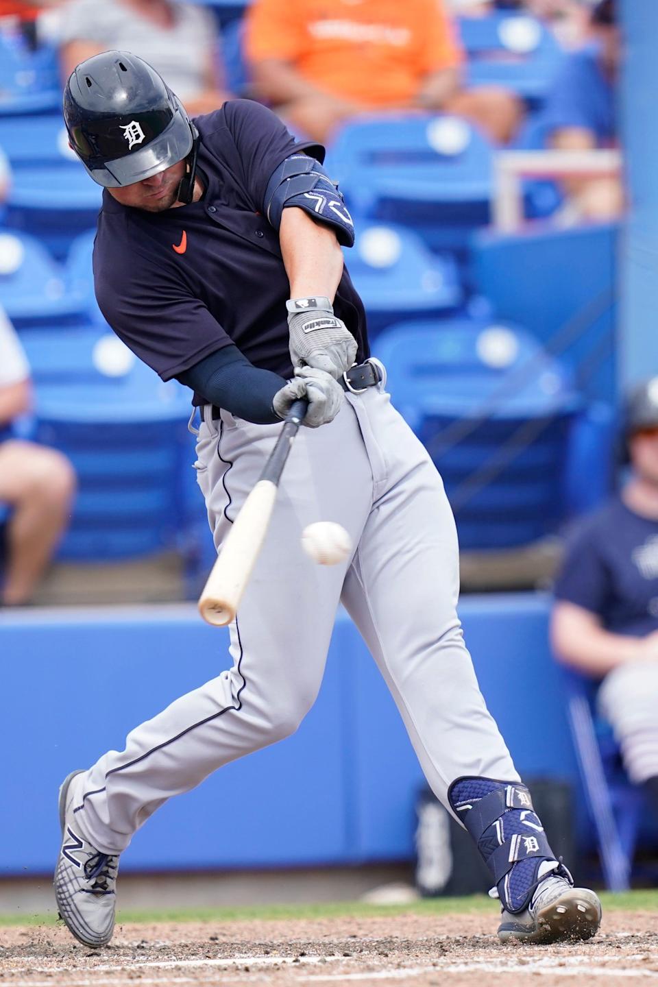 Tigers first baseman Spencer Torkelson hits a single during the fifth inning of the 5-3 loss in the spring training baseball game against the Blue Jays on Thursday, March 31, 2022, in Dunedin, Florida.